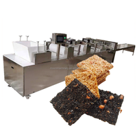 Machine à couper les barres de cacahuètes et de granola Moxin |   Ligne de production automatique de barres de céréales et de nougat
