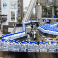 Machine de remplissage d'eau potable de précision, unité d'emballage servo-électrique pour produits liquides en bouteille plastique