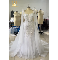 Robe de mariée sirène moderne ZB5839 avec décolleté plongeant, dos nu, cape transparente, bretelles, broderies florales, dentelle florale 3D et tulle, traîne chapelle