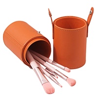 Vente en gros de porte-pinceaux de maquillage en forme de tube rond en cuir PU avec logo personnalisé, coque rigide, portable, pour les voyages