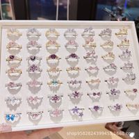 Bague ajustable de style français, luxe léger, design de niche, plaquée or cuivre, avec accents de zircon et motif floral papillon émaillé