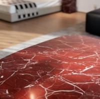 Table basse ovale arrondie en marbre rouge moderne haut de gamme avec quatre pieds cylindriques, mobilier de salon de luxe écologique