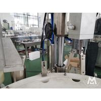 Machine automatique de remplissage et de bouchage de flacons compte-gouttes pour huiles essentielles