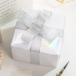 Metallized Gift <b>Wrap</b> <b>Paper</b> with Silver Ribbon Bow for Elegant Packaging - Product Image 1