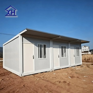 บ้านคอนเทนเนอร์เคลื่อนที่ XH-ACH ขนาด 20 ฟุต โครงสร้างเหล็กสำเร็จรูป ฉนวนกันความร้อนแบบแซนวิช ดีไซน์ทันสมัย รับประกัน 1 ปี เหมาะสำหรับโรงแรมในตลาดดูไบ - Product Image 1