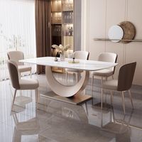 Table à manger extensible en acier inoxydable de style italien ensemble de chaises Design moderne 6 places légères de luxe prêtes pour les mariages de petite taille