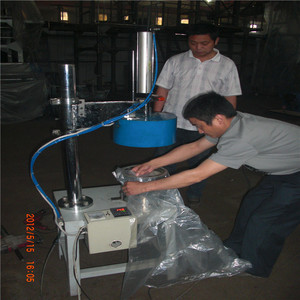 Machine à souder les capuchons et manches de ponchos jetables Hongtong RHT-220 220V, soudeuse plastique pour la production de ponchos pour enfants - Product Image 1