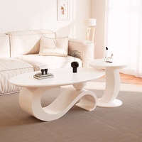Table basse simple et moderne à vent en crème pour personnes âgées vivant dans de petits appartements Nouvelle combinaison de table à thé de luxe