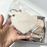 Petit miroir de poche rotatif en cuir PU en forme de cœur avec mousqueton, pour maquillage et cosmétiques, personnalisable avec logo
