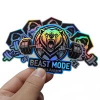 Étiquette autocollante holographique personnalisée en cercle avec logo en colle laser noire pour la promotion, l'épicerie, l'exposition