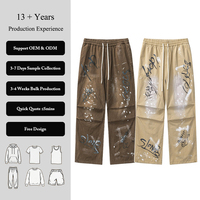 Pantalon Streetwear pour Homme Imprimé Graffiti Numérique Effet Peinture Éclaboussée Coupe Large à Panneaux Décontracté Confortable Style Tendance