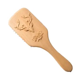 Wholesale customization of LOGO airbag wood comb in Chinese factories to produce carved deer wood products Deer carving