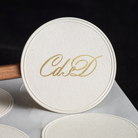 Autocollant texturé imprimé personnalisé étiquette en relief cercle mat bosse Beige blanc pur étanchéité estampage à chaud logo or autocollants de marque