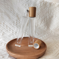 Rouleau de parfum avec LOGO personnalisé bouteille de 10ml en verre épais carré mince avec couvercle en bambou et rouleau en acier métallique pour huiles essentielles