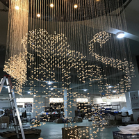 Grand lustre suspendu en forme de montagne pour hall d'hôtel, luminaires de plafond personnalisés en cristal transparent, design artistique créatif