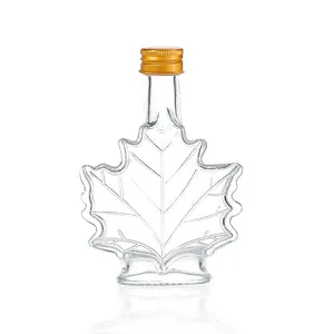 Özel alüminyum mantar kap ile sıcak satış Deluxe Maple Leaf şekilli cam şişe