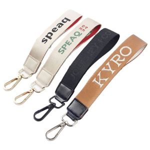 <b>Custom</b> Design Woven Embroidery Lulu Wrist Strap Key Lanyard Gift Promotional Branded Logo Leather <b>Keychain</b> - Product Image 6