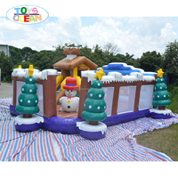 Parc de jeux gonflable de Noël en forme de cabane d'hiver, maison de jeu gonflable à thème de Noël pour enfants avec toboggan pour fêtes et divertissements