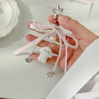 Vente en gros de breloques de téléphone en forme de coeur de patte de chat en ruban, porte-clés en peluche mignon et porte-clés à nœud.