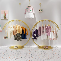 Présentoir Métallique Rond 3/4 Créatif pour Boutique, Porte-Vêtements Rond Idéal, Support d'Exposition Élégant pour Vêtements