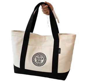 Sacs fourre-tout en toile de coton noir bio recyclé écologique avec poche, motif lettres et fermeture éclair - Product Image 1