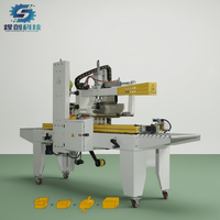Machine de fermeture et d'étanchéité automatique de boîtes en carton, petite, électrique, avec tête de ruban adhésif de 50 mm pour les applications de boissons et de produits chimiques