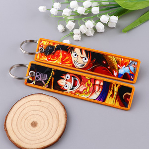 พวงกุญแจผ้าทอลายการ์ตูนเจ็ทพวงกุญแจจี้รูปอะนิเมะสำหรับรถจักรยานยนต์และรถยนต์ที่มีการพิมพ์สกรีนผ้าไหม - Product Image 4