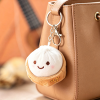Vente en gros usine : Charm de sac en peluche mini Baozi doux et adorable, porte-clés alimentaire avec visage brodé, cadeau idéal pour étudiants