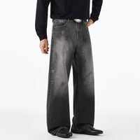 Jeans délavés tendance style américain avec motif encre rétro, coupe ample et droite, en denim