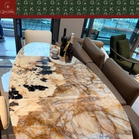 Table à manger ovale de luxe GOLDKING avec plateau en marbre Patagonia, base en métal brossé, OEM ODM CAD 3D personnalisé pour maison moderne
