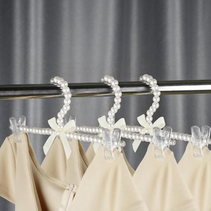Cintres pour pantalons en perles <span class=keywords><strong>Porte</strong></span>-vêtements en plastique avec nœud papillon avec organisateur à clips pour ranger les robes Chemises Pantalons Jupes dans le placard des chambres à coucher - Product Image 1