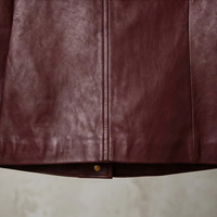 Veste courte en cuir d'agneau véritable pour femme, col rond mat, boutons dorés en relief, poches obliques sur la poitrine, coupe ample, style vintage