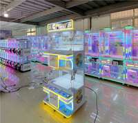 Machine à griffes LED pour capsules et peluches, pour centres commerciaux et boutiques, multijoueur, pour entreprises de jeux d'arcade et startups, prix