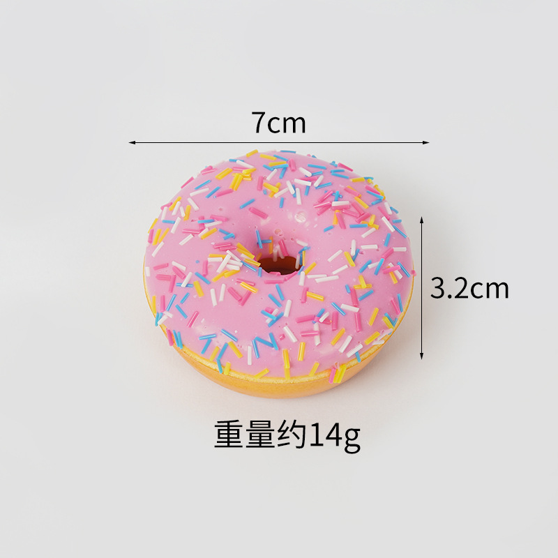 Imán para nevera con forma de donuts rosas glaseados, con parte posterior magnética.