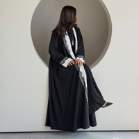 Nuosha OEM Nouvelle Abaya de mode musulmane de Dubaï et du Moyen-Orient, en dentelle noire de qualité supérieure avec empiècements noir et blanc