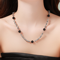 Collier Mlluki en acier inoxydable avec motif os, noir et blanc, style hip-hop, bijoux en pierre naturelle noire pour femme, idéal comme cadeau
