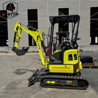 Mini-excavatrice sur chenilles haute performance, compacte et multifonctionnelle, avec accessoires marteau et tarière, pour projets d'aménagement paysager résidentiel