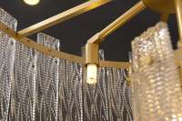 Lustre suspendu linéaire moderne de luxe en laiton et verre pour plafond bas, idéal pour table à manger