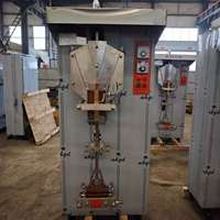 Machine d'emballage entièrement automatique pour le remplissage de petits sachets de lait et d'eau en sacs plastiques. Vente directe d'usine. Prix bas.