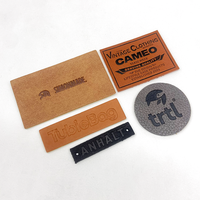 Étiquettes et étiquettes de vêtements personnalisées en cuir véritable avec logo en relief pour sacs et chaussures