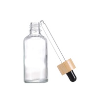 Flacons en verre transparents sérigraphiés de 5 ml à 100 ml pour crèmes et sérums visage, avec compte-gouttes en bambou