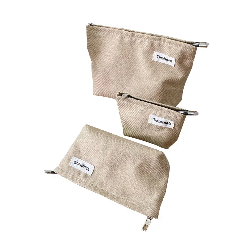 Bolso de mano de lino de nuevo diseño Bolso portátil con cremallera para mujer Bolso de maquillaje portátil de gran capacidad