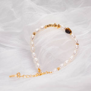 Joyería de Moda Minimalista para Mujer: Delicada Pulsera de Perlas de Arroz con Cadena Ajustable de Piedra Ojo de Tigre en Forma de Bola para Regalos - Product Image 4