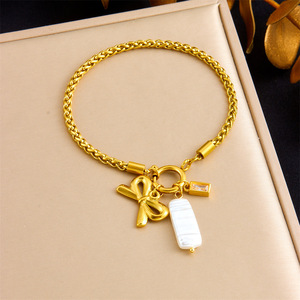 Gold Plated Braided Chain Bracelet With Bow And Shell Charm Stainless Steel Jewelry Gift - Product Image 1