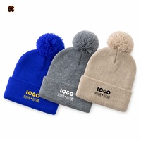 Bonnet tricoté personnalisé avec logo, pompon et revers, chaud et extensible pour l'hiver, bleu roi, gris chiné, kaki, unisexe, vente en gros, OEM