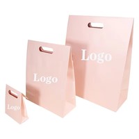 Emballage cosmétique rose de luxe, logo personnalisé imprimé, écologique, durable, poignées découpées, sacs en carton classiques et élégants pour le shopping