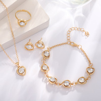 Parure quatre pièces en alliage sertie de diamants, collier, boucles d'oreilles, bague et bracelet en forme de cœur, bijoux transfrontaliers pour un style européen chic