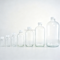 Prix direct usine – Bouteilles en verre Boston rondes Super Flint transparentes de 1/2 oz, 1 oz, 2 oz, 4 oz, 8 oz, 16 oz, 32 oz avec bouchon en bakélite