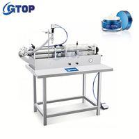 Machine de remplissage pneumatique horizontale, machine de distribution de liquide lessive, machine de remplissage quantitatif semi-automatique de liquides