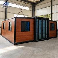 Maison modulaire extensible à double aile de 20, 30 ou 40 pieds avec porte d'entrée centrale en verre pour maison-conteneur de jardin